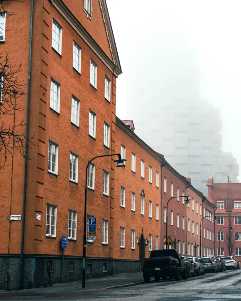 Red brick apartment building on a quiet Stockholm street
