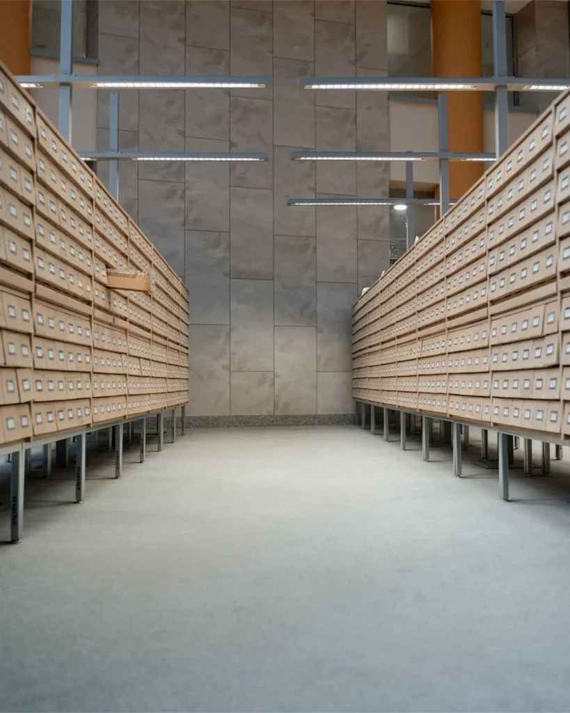 Rows of archived case files in a records room
