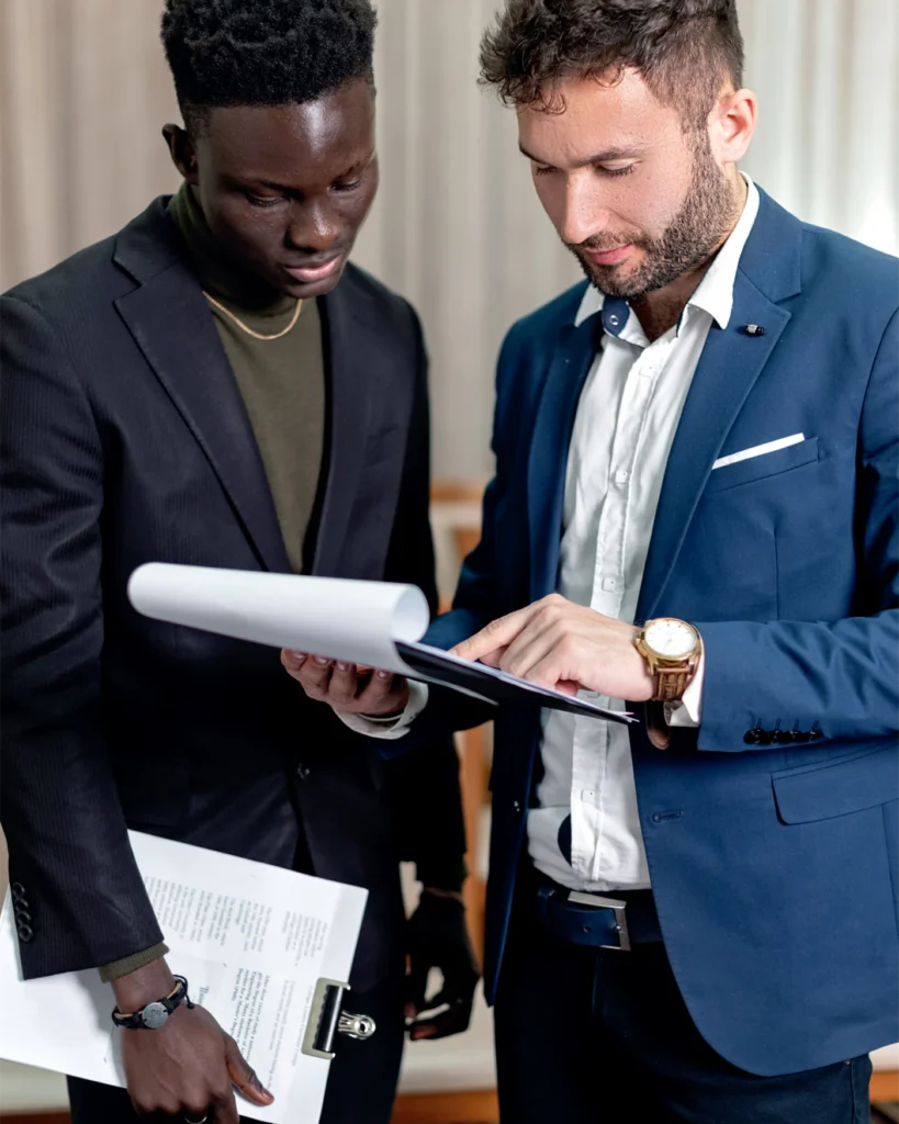 Two professionals reviewing an executive agreement together