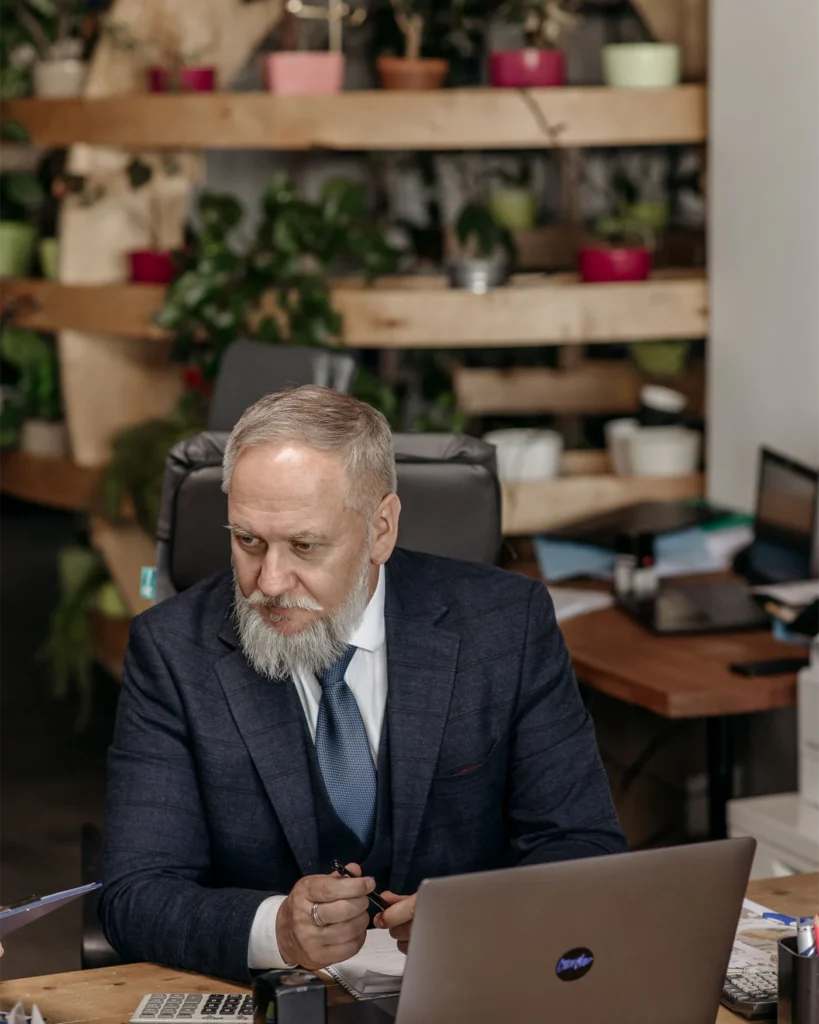 Senior executive working at his desk in a bright office