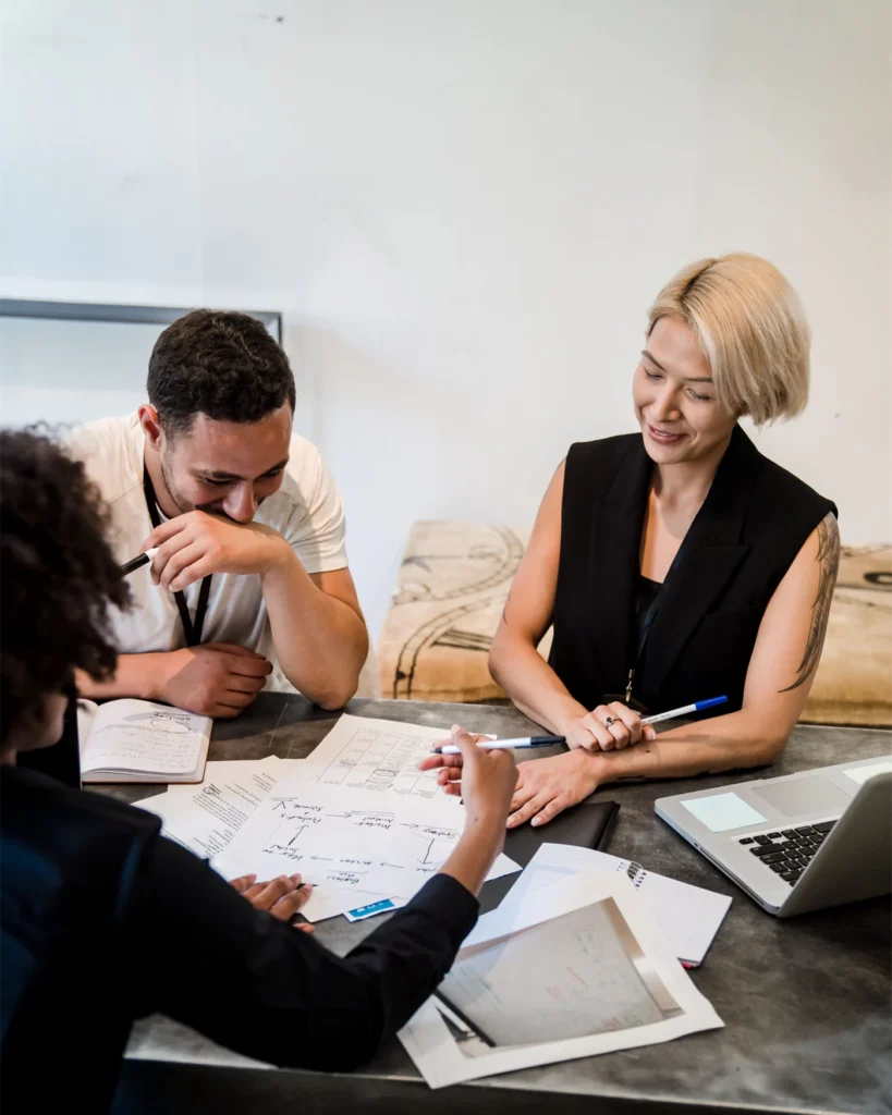 A team reviewing case documents together at a meeting table