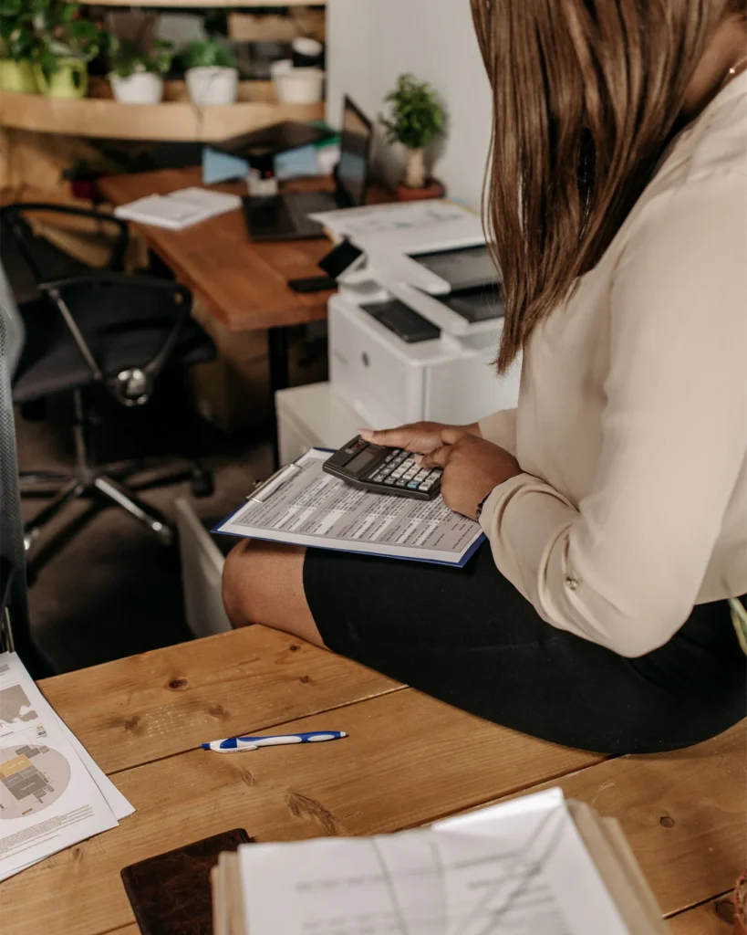 A professional checking figures against a claim document