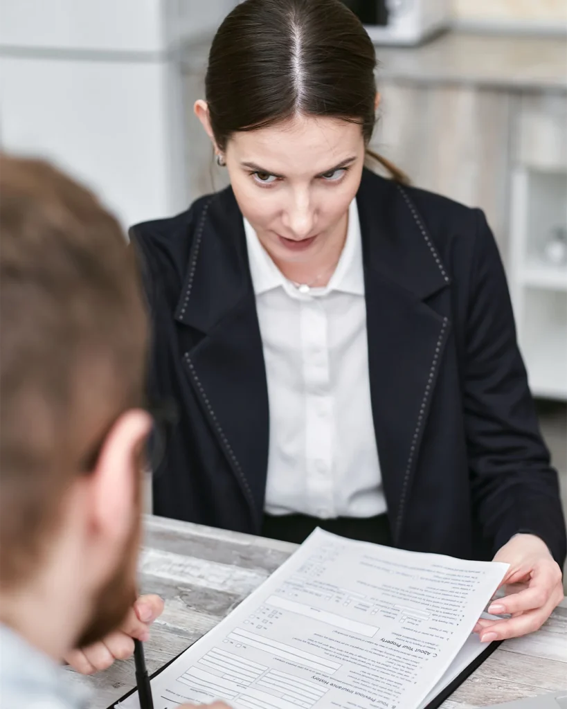 An adviser going through a policy document with a client