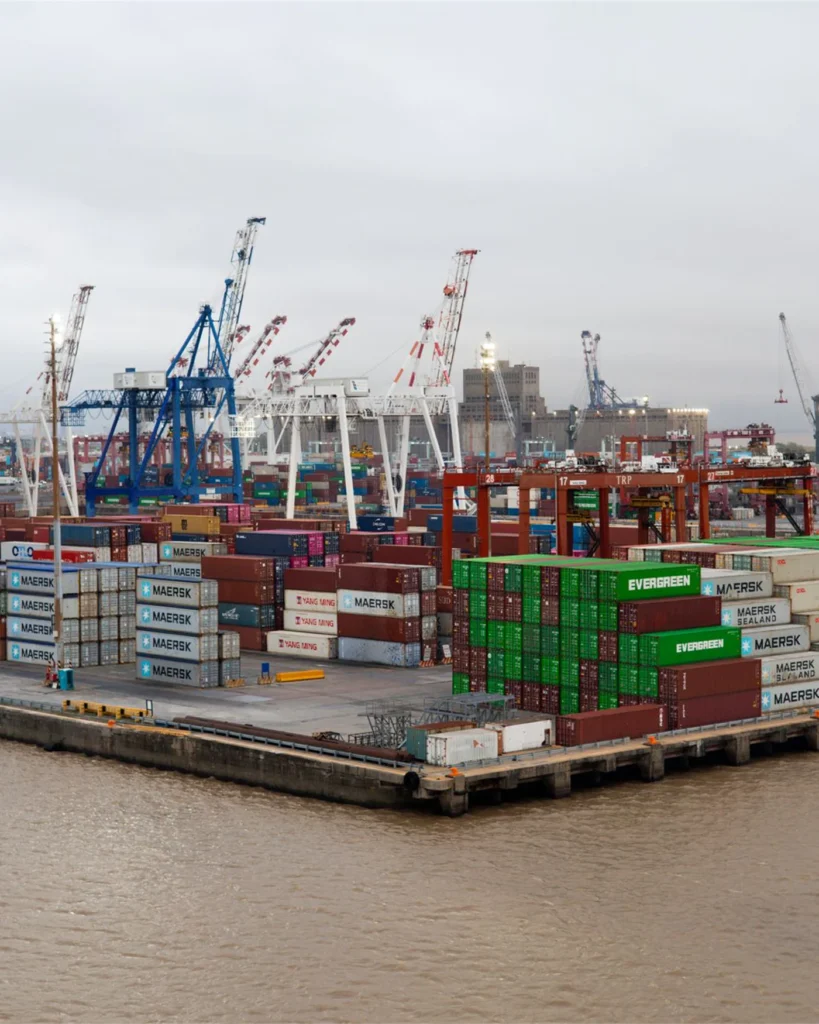 Freight containers and cranes at a working port