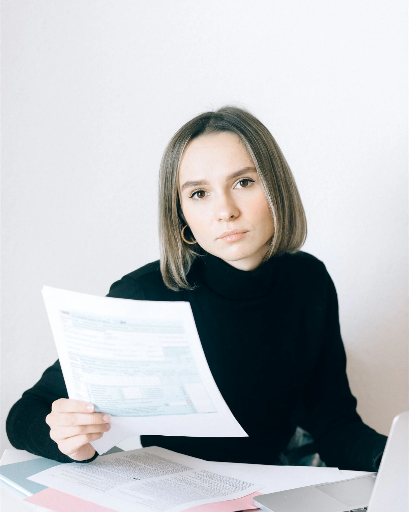 Executive reading through documents in a quiet meeting room