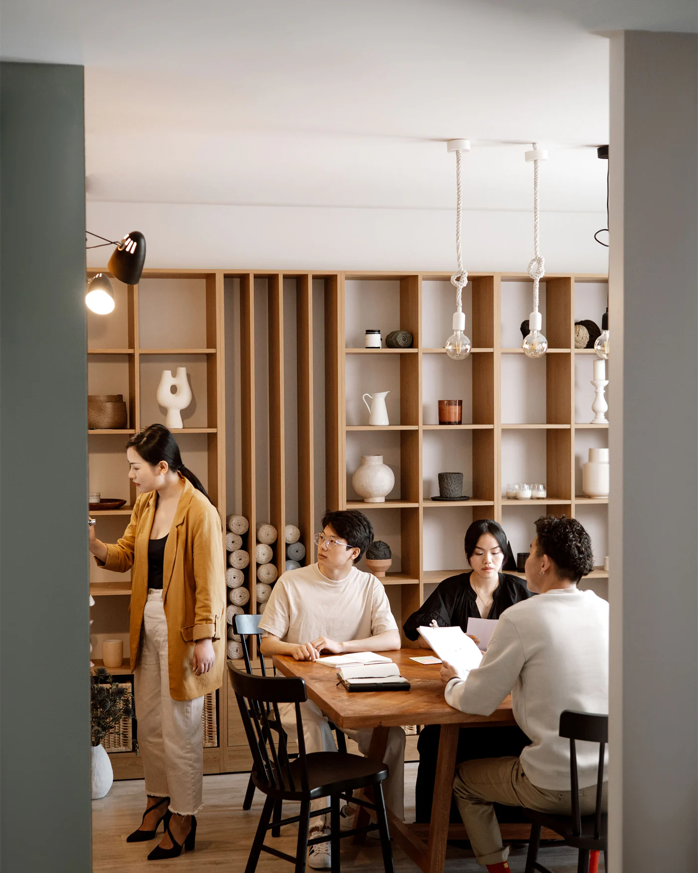 Colleagues seated around a table in a calm working discussion