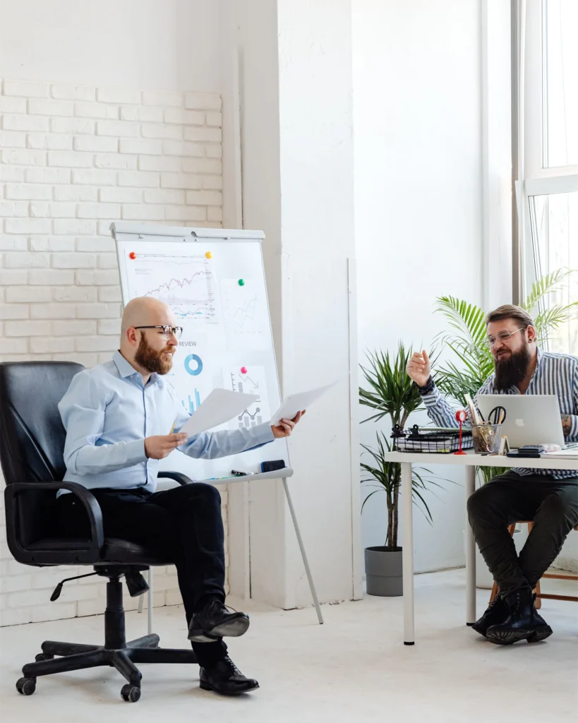 Colleagues working through a case together in a bright office