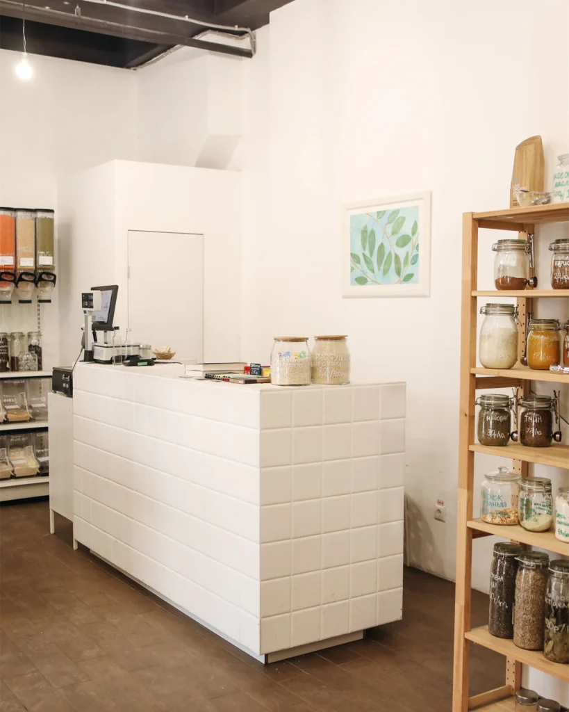 A minimal retail store interior with wooden shelving