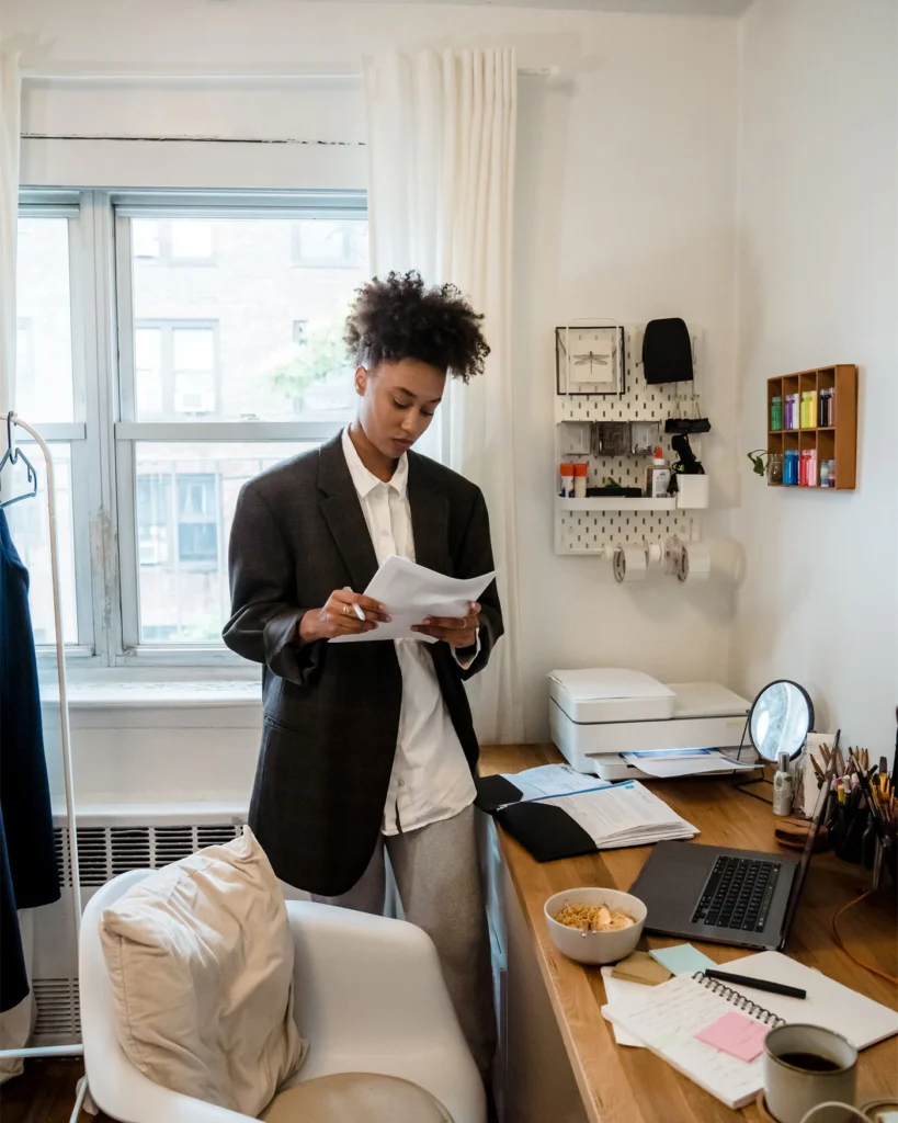 Property owner reviewing documents at a desk at home