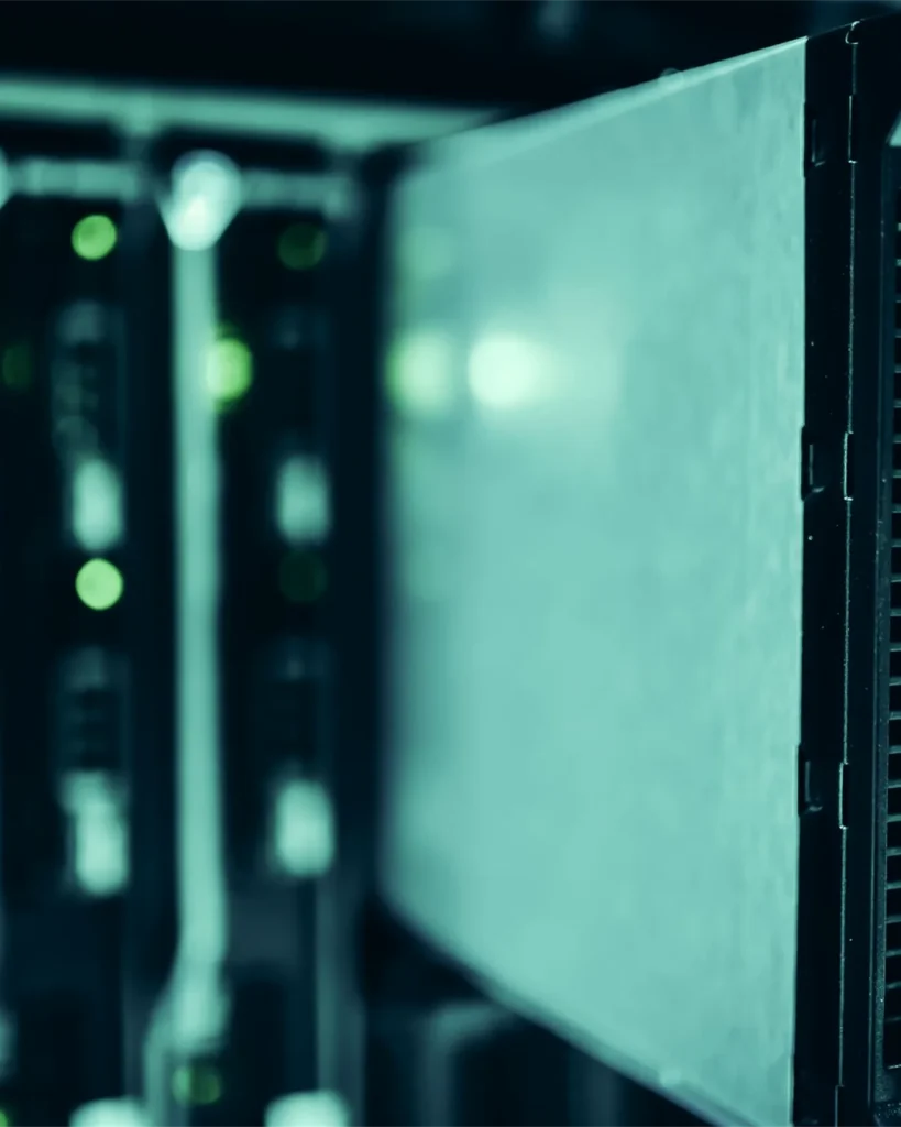 A secured server cabinet standing open in a data centre
