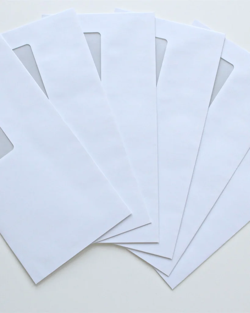 Formal notice envelopes fanned out on a desk