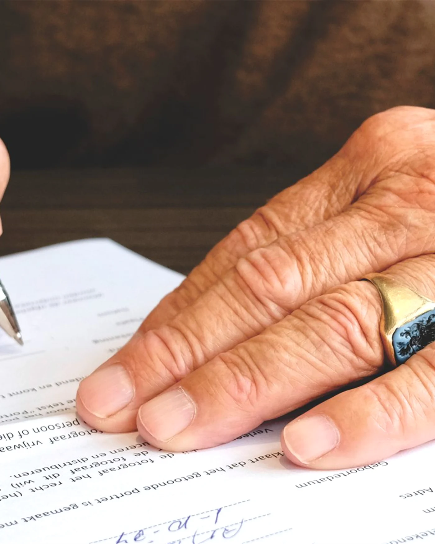 A will being signed at a desk