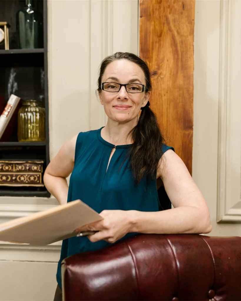 A lawyer with a case file in her office