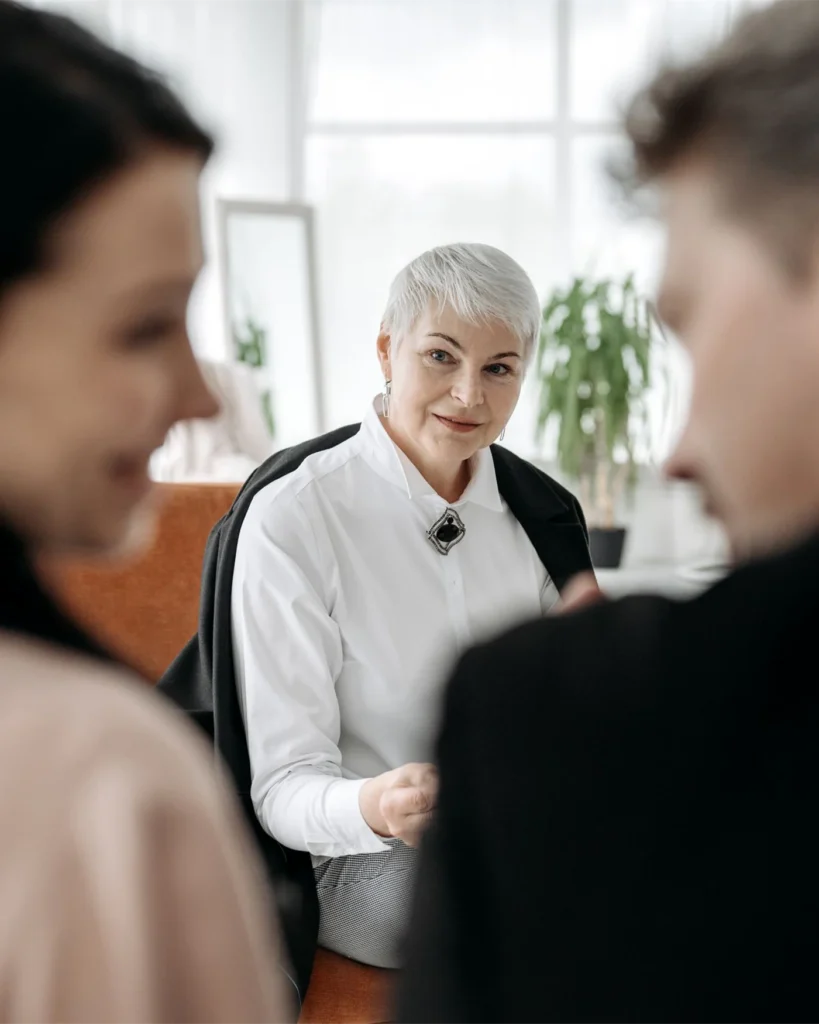 Parents meeting a case worker in a bright office